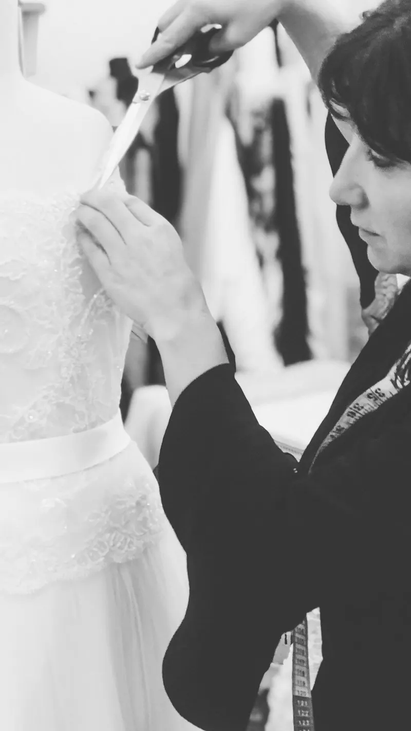 Cutting fabric for a wedding gown in the Catherine Colubriale atelier