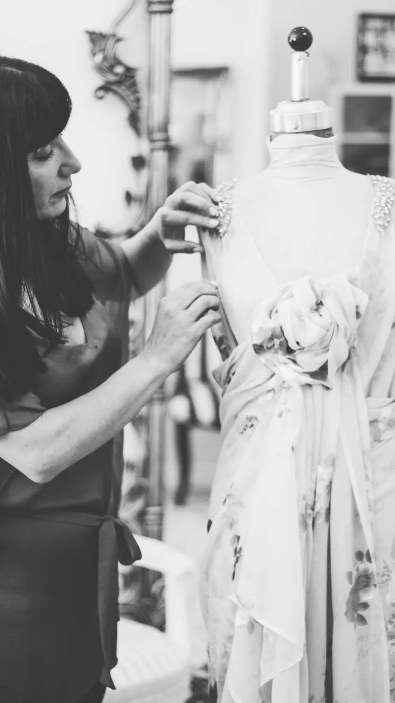 Catherine Colubriale at work on a gown in her atelier