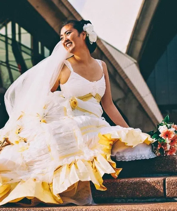 Gloria, A Victorian-inspired corset gown with a bustled train