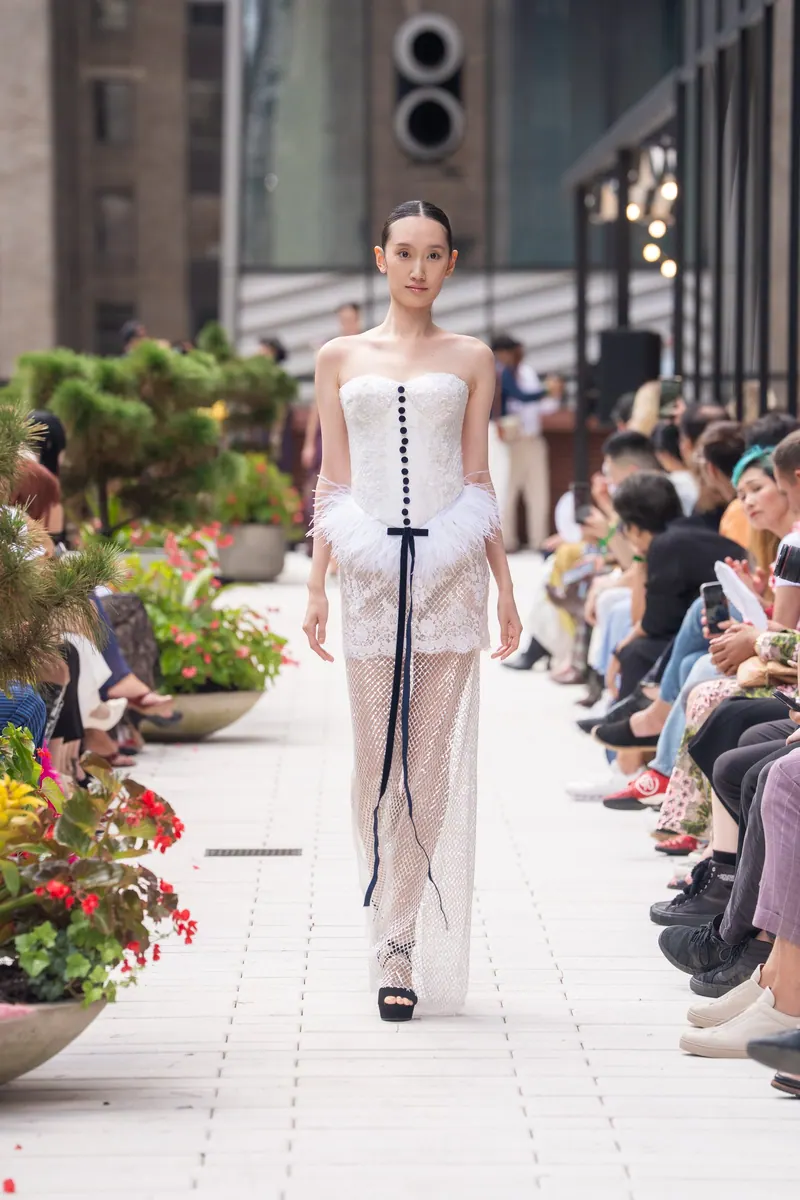 New York Fashion Week 2026, look 1: Ivory lace corset on the runway