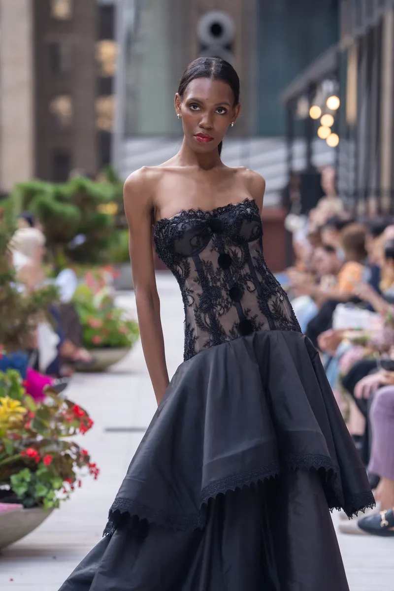 Detail of the black Chantilly lace finale gown from the Evening Couture Collection